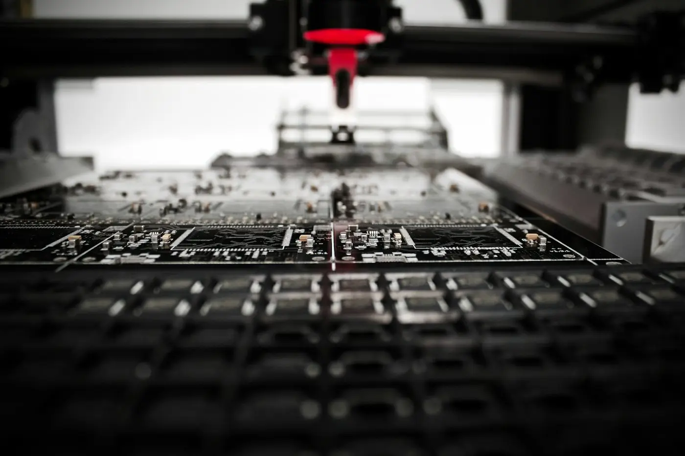 Robotic pick-and-place head over a circuit board